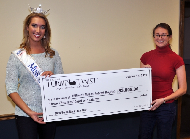 Turbie Twist presents Miss Ohio, Ellen Bryan, with a check for $3008 for the CMNH